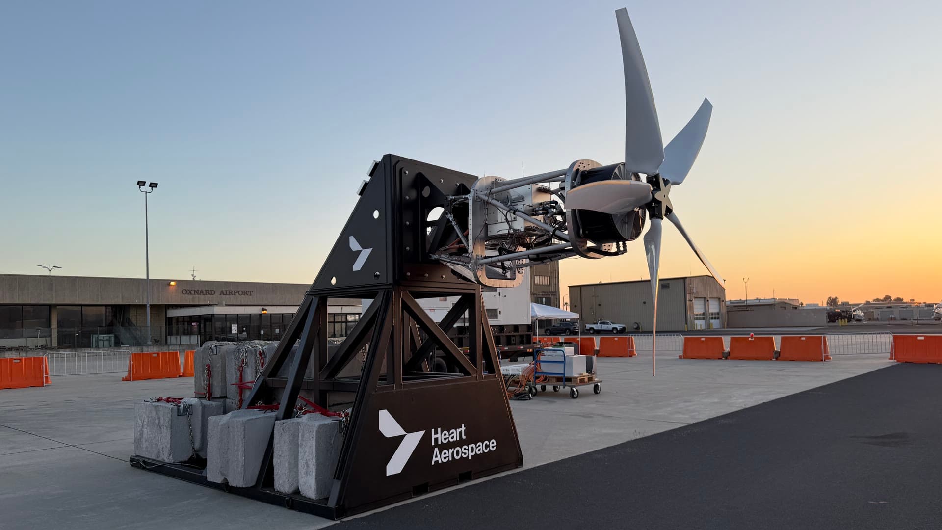Heart Aerospace propulsion test rig and propeller on the apron at Oxnard Airport at sunset