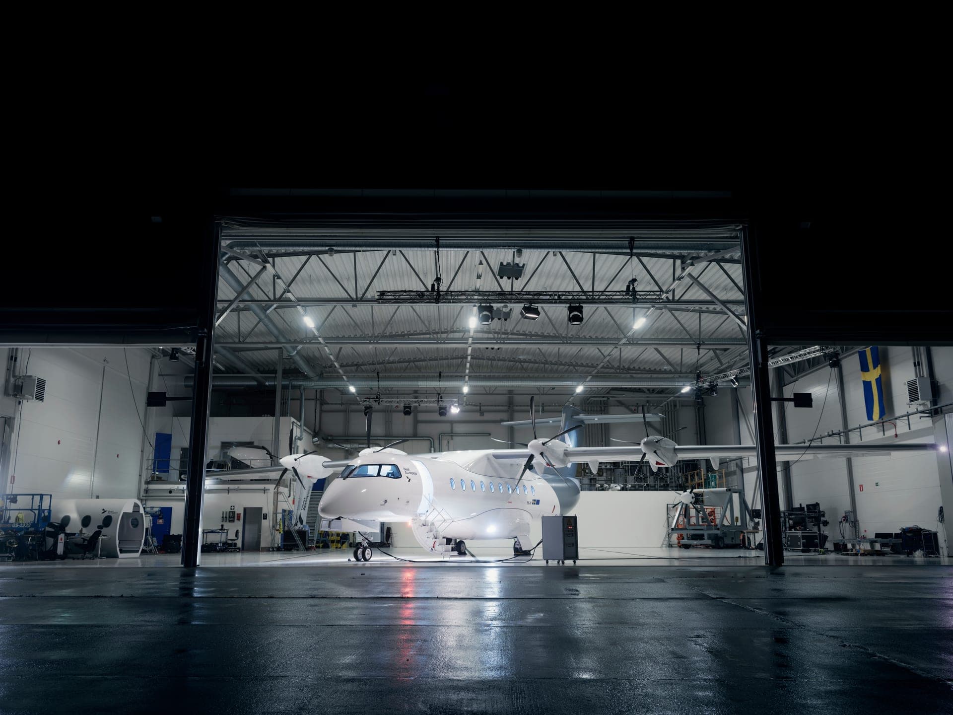 Heart X1 demonstrator in the hangar at the rollout event, lit from below
