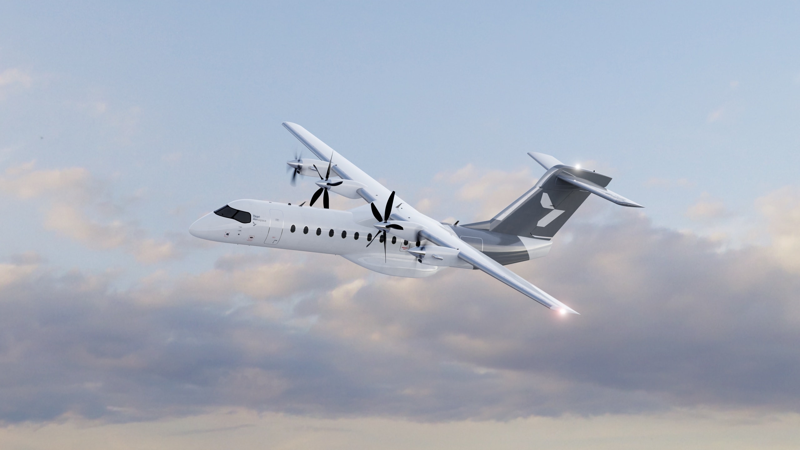 Heart Aerospace ES-30 aircraft in cruise flight, banking gently against a soft cloudy sky